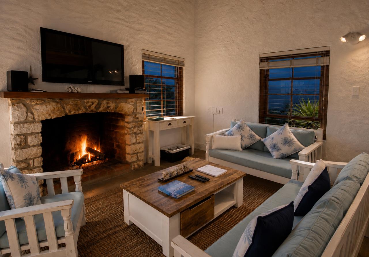 Living room with fireplace at Shalom Beach House