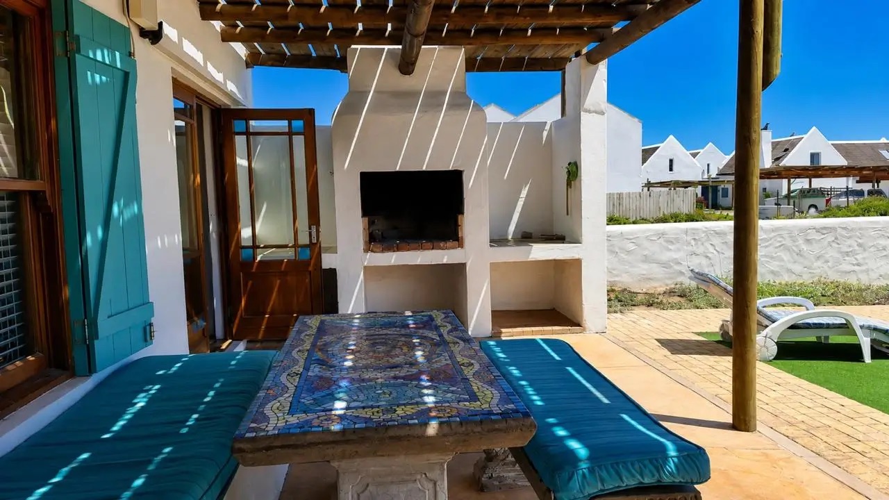 Outdoor braai on the patio at Shalom Beach House