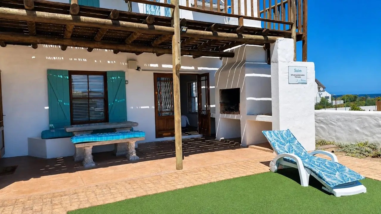 Patio area with sea views at Shalom Beach House